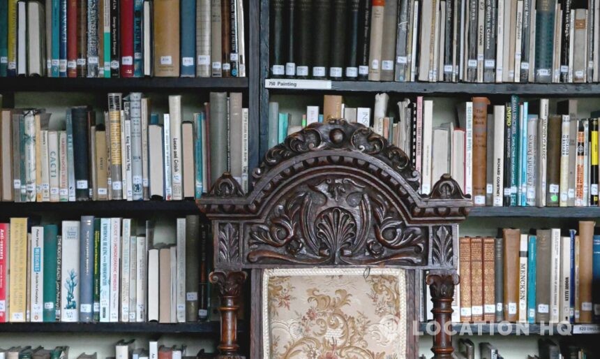 Panelled library with antique books and historic décor