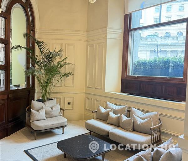 London office waiting area with sofas.