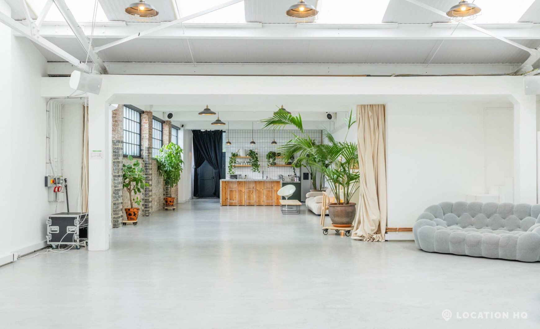 Minimalist white studio space for photography and filming.