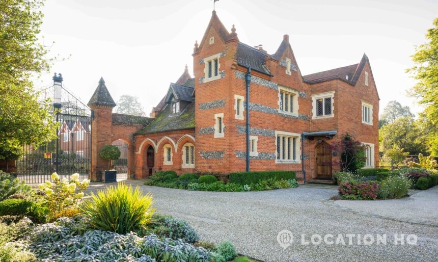 Brick and flint boundary wall with estate gate