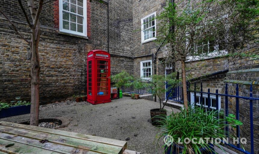red telephone box London street road courtyard